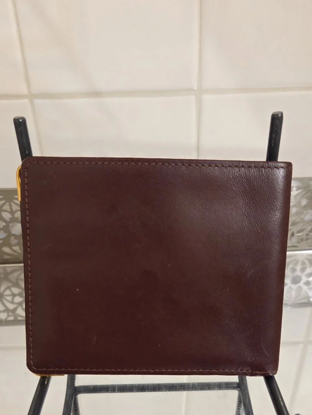 Cartier Leather Bifold Wallet in Deep Maroon with Gold Corner Accents